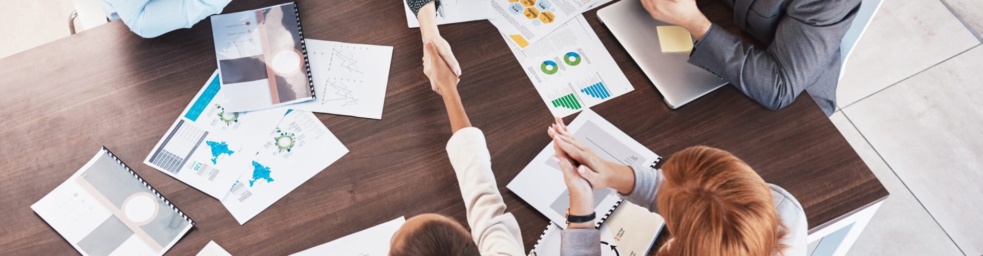 Business handshake, partnership and contract agreement of corporate clients in a meeting room. Crm,.