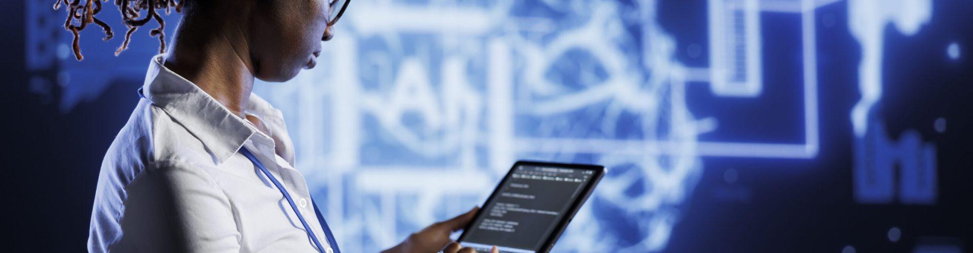 Knowledgeable admin updates neural networks made of interconnected nodes, writing intricate lines of code on tablet. High tech establishment employee uses programming to upgrade AI simulation model