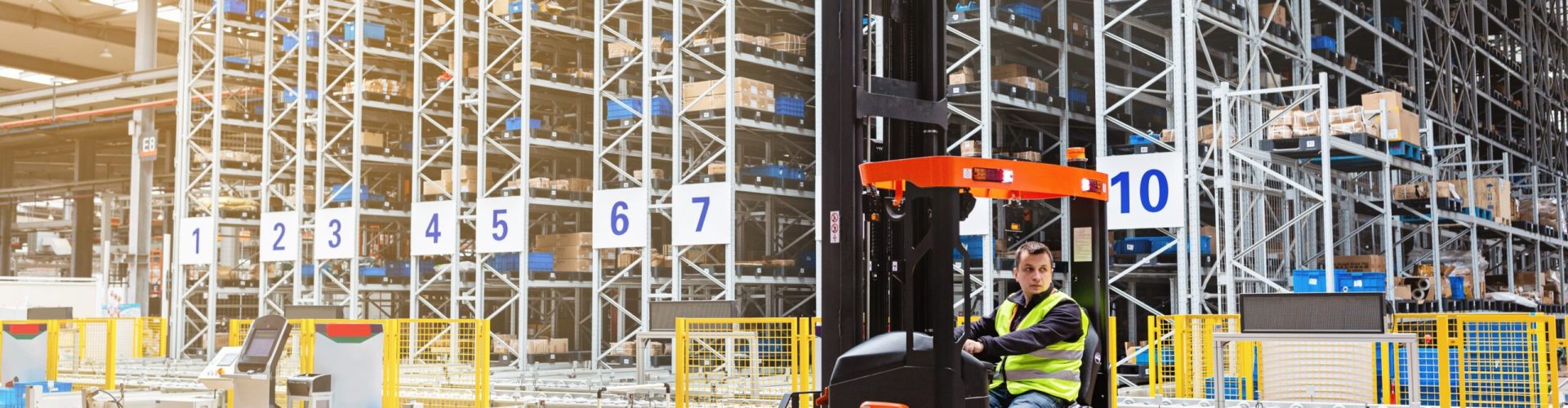 employee-working-on-forklift-in-modern-automatic-w-2023-11-27-05-31-14-utc