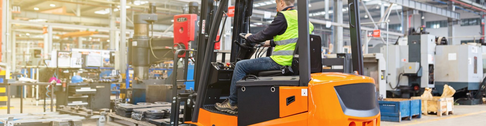 storehouse-employee-in-uniform-working-on-forklift-2023-11-27-04-52-38-utc